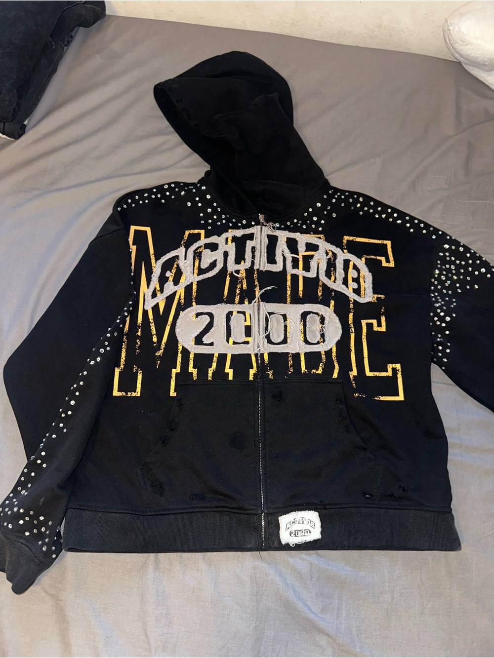 Black Studded Zip-Up Hoodie with Bold Yellow Graphic
